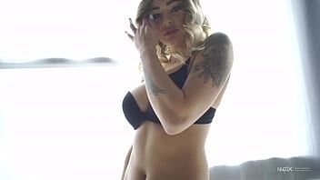 Play Dressed in a very hot black lingerie, this beautiful blonde stands in front