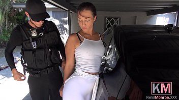 Play A policeman enters a brunette in her car